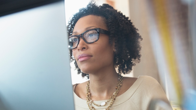 A person looking at a computer 