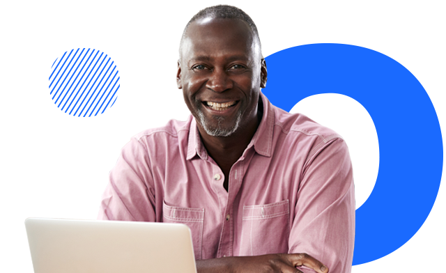 A person sits in front of the laptop
