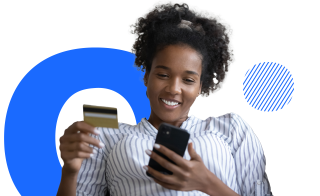 A person looking at a mobile phone and holding a credit card