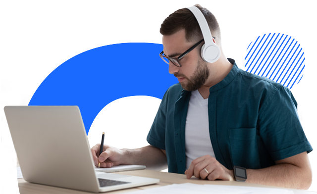 A person with headphone working on laptop